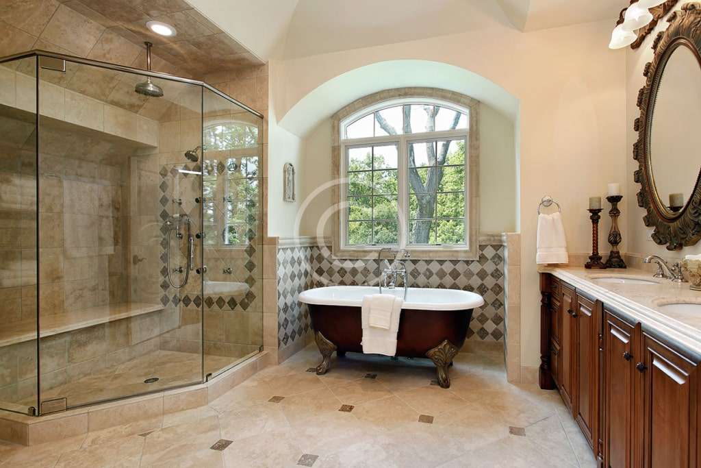 A bathroom with a tub, shower and sink.