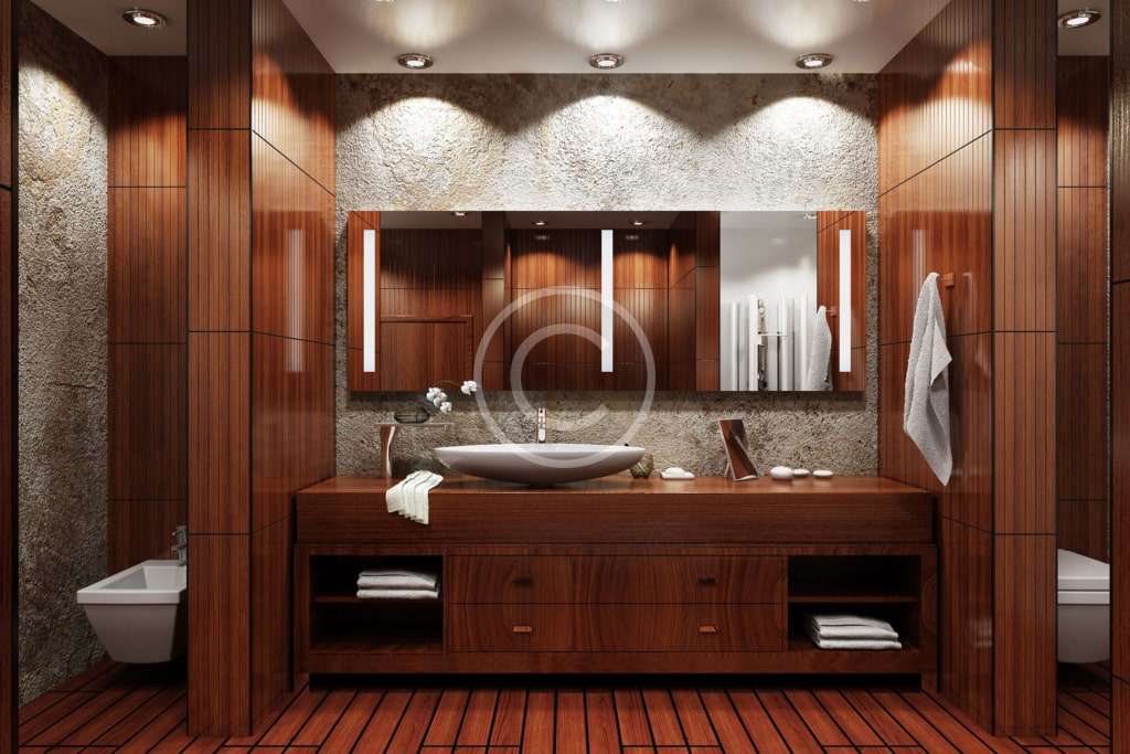 A bathroom with wood cabinets and a sink.